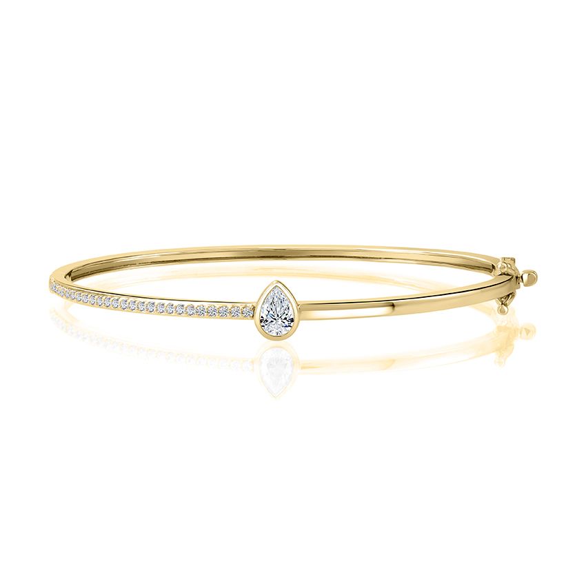 Bangle with bezel set pear shape