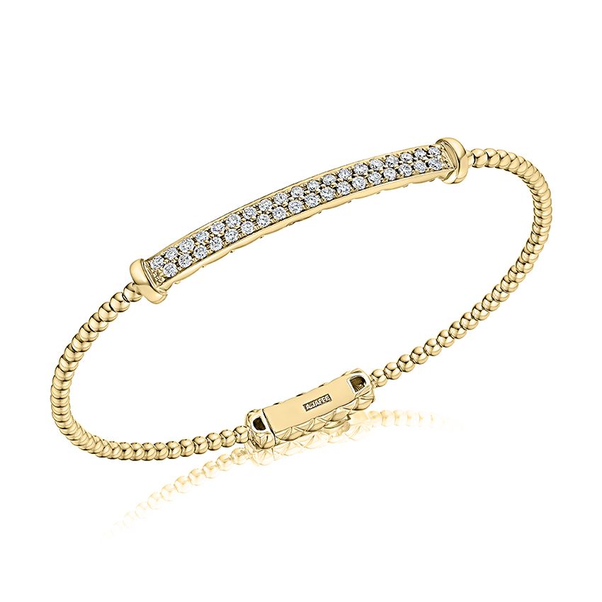 Flexible bangle with diamonds and Quilts® detail on the inside. With lock